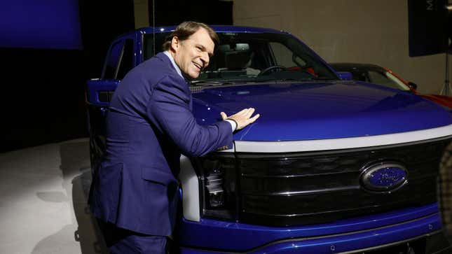 Ford CEO Jim Farley pats a Ford F-150 Lightning truck before announcing at a press conference that Ford Motor Company will be partnering with the world's largest battery company, a China-based company called Contemporary Amperex Technology, to create an electric-vehicle battery plant in Marshall, Michigan, on February 13, 2023 in Romulus, Michigan.