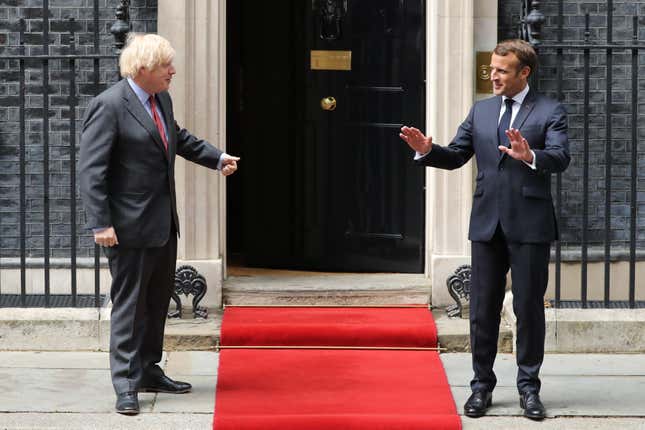 Prime Minister, Boris Johnson greets French President, Emmanuel Macron while keeping a social distance at Number 10 Downing Street on June 18, 2020.