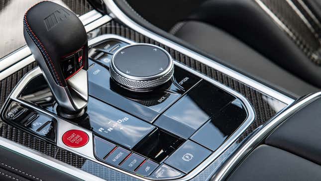 A photo of a polished black center console in a BMW. 