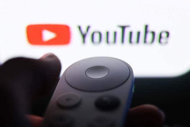 YouTube logo on a TV screen and a remote control are seen in this illustration photo.