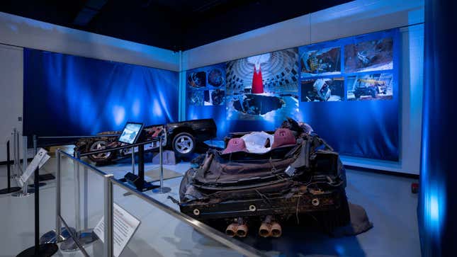 A photo of two smashed corvettes on display at the museum
