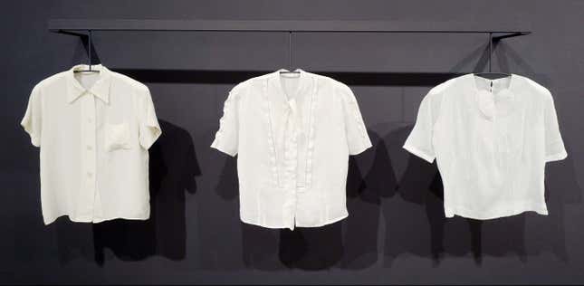 In this March 16, 2017 photo, white linen blouses worn by American artist Georgia O'Keeffe are exhibited at the Brooklyn Museum in New York. Guest curator Wanda Corn concludes that O'Keeffe, who made many of her clothes, also was an artist "in her homemaking and self-fashioning." (AP Photo/Mark Lennihan)