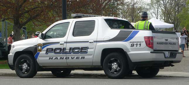 A silver police Honda Ridgeline