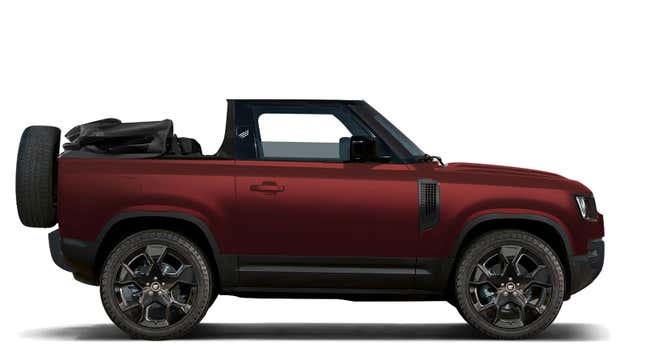 A red Land Rover Defender with a convertible roof.