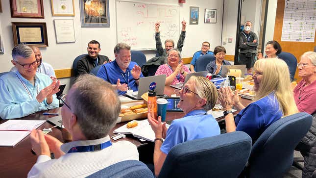 Members of the Voyager flight team celebrate after receiving the signal back from Voyager 1 on April 20.
