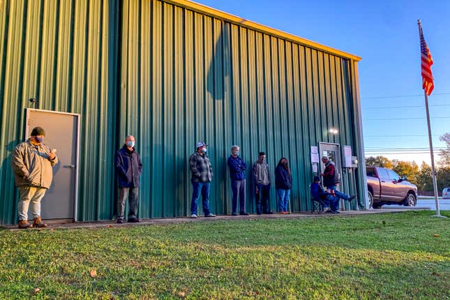 FILE - Voters wait for the polls to open to cast their ballots in the 2020 election at the Farmville Volunteer Fire Department, Nov. 3, 2020, in Auburn, Ala. Some 170 foundations, donors and advisors have signed on to a pledge started by the nonprofit Democracy Fund to make their grants earlier this Election Year. A small portion of the billions spent around the November election will go to nonprofits working to boost voter participation and usually, those funds come in right before Election Day. (AP Photo/Julie Bennett)