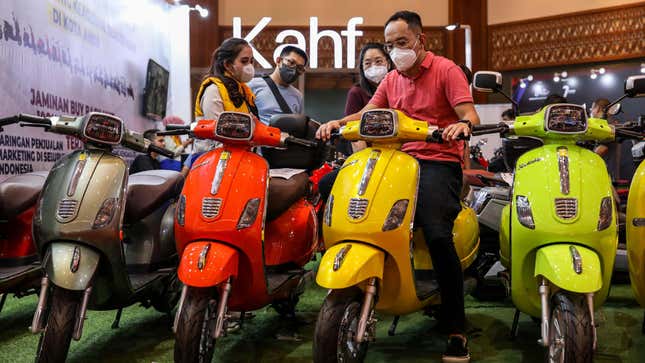 A row of four motorcycles on display