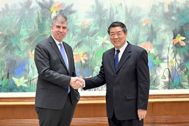 In this photo released by Xinhua News Agency, Chinese Vice Premier He Lifeng, right, shakes hands with Jay Shambaugh, a delegation led by Under Secretary of US Department of Treasury prior to their 3rd China-US Economic Working Group Meeting in Beijing, Tuesday, Feb. 6, 2024. (Yin Bogu/Xinhua via AP)