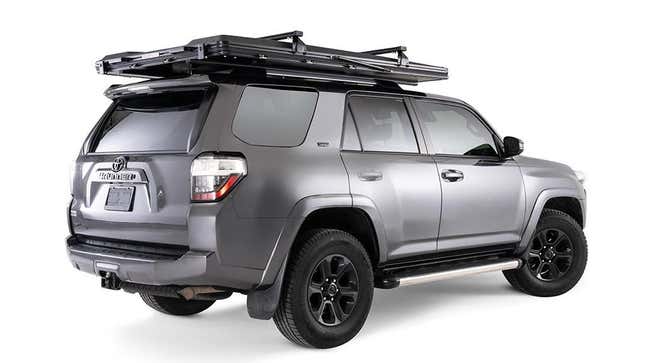 A rear 3/4 view of the dark gray 4RUnner with the Falcon EVO 3 XL closed with roof racks on top of the closed tent