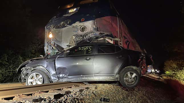 Image for article titled This Is What Happens When A Speeding Amtrak Train Strikes A Stranded Car Hauler