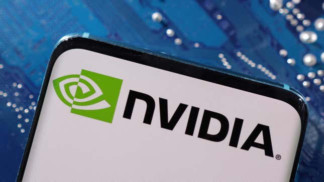     This illustration, taken on March 6, 2023, shows a smartphone with the NVIDIA logo on a computer motherboard.