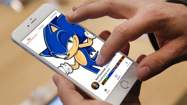 A mobile device screen displays a composite image of the GETTR social app and a smirking, shrugging Sonic the Hedgehog.