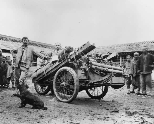 Auguste Pons and his mechanic Octave Foucault, two competitors in the Peking (Beijing) to Paris motor race, with their three-wheeled Contal laden with equipment, 1907