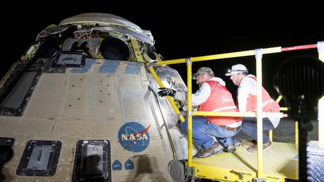 This handout image supplied by NASA shows Boeing and NASA teams work around NASA's Boeing Crew Flight Test Starliner spacecraft after it landed uncrewed at White Sands Space Harbor, on September 6, 2024 at White Sands, New Mexico.