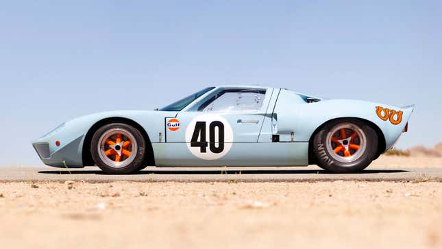 A profile photo of a pale blue Ford GT race car. 