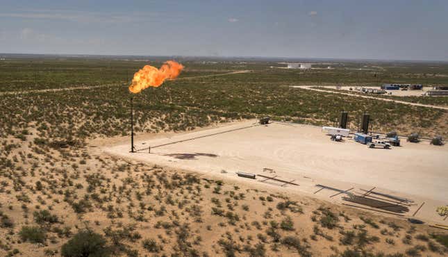 A gas flare is seen in this aerial photograph taken above a field.