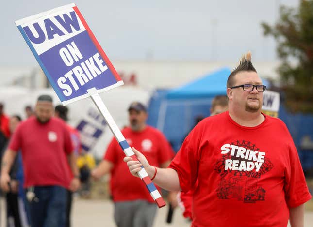 Brian &quot;Rooster&quot; Heppner, a United Auto Workers Local 12 member, pickets during the ongoing UAW strike at the Stellantis Toledo Assembly Complex on Wednesday, Oct. 25, 2023, in Toledo, Ohio. (Kurt Steiss/The Blade via AP)