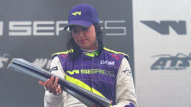 Jamie Chadwick holding the W Series Championship Trophy in 2019