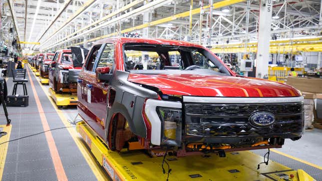 Ford F-150 Lightning pickup trucks sit on the production line at the Ford Rouge Electric Vehicle Center on April 26, 2022 in Dearborn, Michigan.