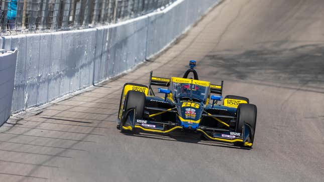 Colton Herta driving his black IndyCar around Gateway last season