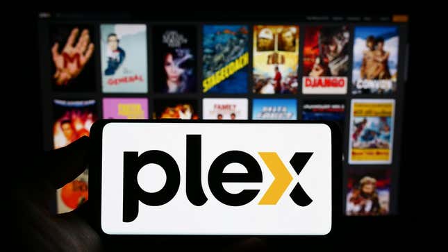 Person holding phone that's playing Plex