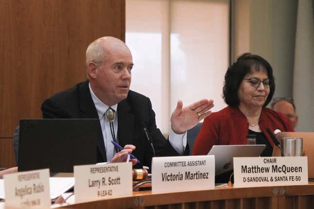 New Mexico state Rep. Matthew McQueen, D-Galisteo, left, discusses proposed changes to state oil and natural gas regulations on Thursday, Jan. 25, 2024, in Santa Fe, N.M., under a bill he is co-sponsoring. An effort to modernize state oversight of a thriving petroleum industry in the nation&#39;s No. 2 state for oil production advanced past its first committee vetting at the New Mexico Legislature. (AP Photo/Morgan Lee)