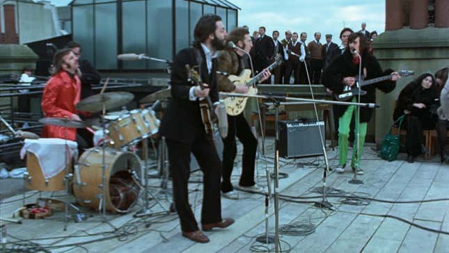 The Beatles performing their famous rooftop concert, as seen in Peter Jackson's new documentary.