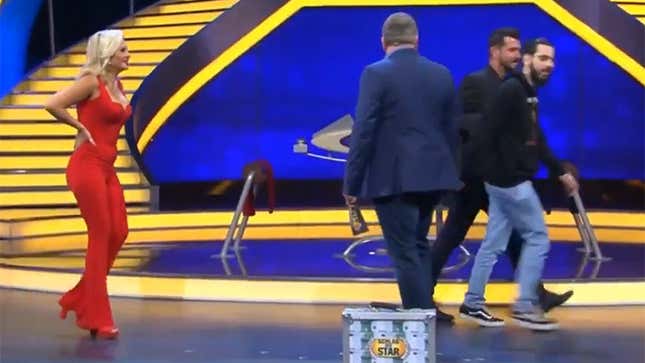 A man is escorted off the stage of a German TV show after demanding information about Grand Theft Auto 6.