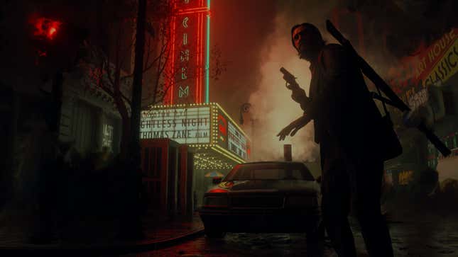 Alan Wake stands holding a gun on a city street at night, illuminated by the neon of a movie theater's marquee.