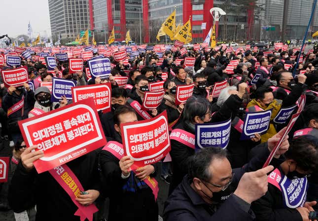 FILE - Doctors stage a rally against the government&#39;s medical policy in Seoul, South Korea, on March 3, 2024. South Korean authorities have suspended the licenses of two senior doctors for allegedly inciting the weekslong walkouts by medical interns and residents that disrupted hospital operations across the country. That&#39;s according to one of the doctors who spoke to The Associated Press. The suspensions are the government’s first punitive step against physicians after thousands of doctors-in-training walked off the job last month to protest the government’s plan to sharply increase medical school admissions. (AP Photo/Ahn Young-joon, File)