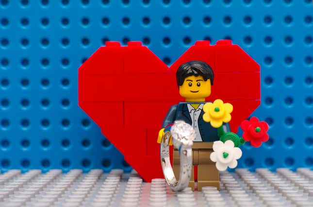 LEGO man with ring and flowers