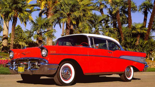 A photo of a red Chevrolet sedan from 1957. 