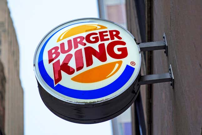 FILE - The Burger King logo is displayed on a sign outside a restaurant in downtown Pittsburgh, Jan. 12, 2022. Food ads have long made their subjects look bigger, juicier and crispier than they are in person. But some consumers say those mouthwatering ads can cross the line into deception, and that’s leading to a growing number of lawsuits. Burger King is the latest company in the crosshairs. (AP Photo/Gene J. Puskar, File)