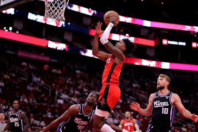 Nov 6, 2023; Houston, Texas, USA; Houston Rockets guard Jalen Green (4) makes a layup against the Sacramento Kings during the first quarter at Toyota Center.