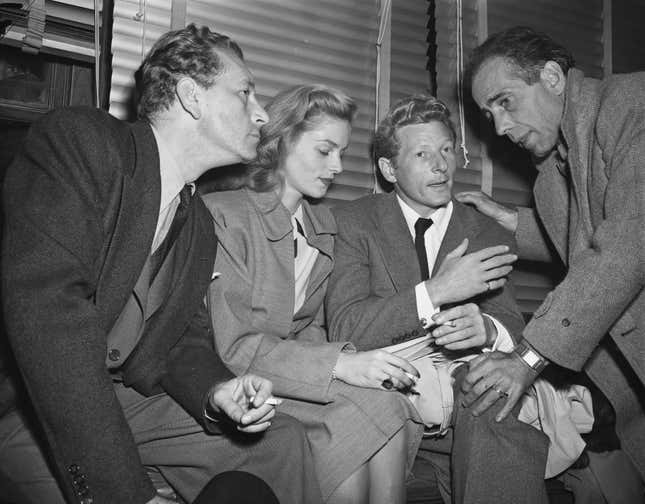 Paul Henried, Lauren Bacall, Danny Kaye and Humphrey Bogart (left to right) are pictured on their arrival by plane to protest the House Un-American Activities Committee’s method of probing alleged Communism in Hollywood.