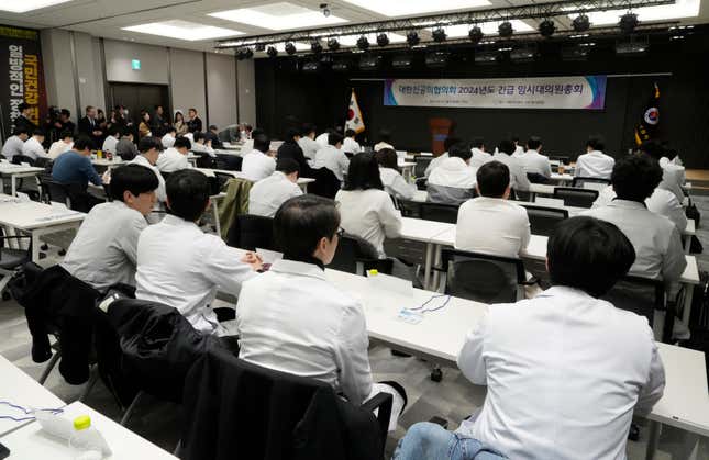 Trainee doctors attend a meeting at the Korea Medical Association building in Seoul, South Korea, Tuesday, Feb. 20, 2024. South Korean trainee doctors collectively walked off their jobs Tuesday to escalate their protest of a government medical policy, triggering cancellations of surgeries and other medical treatments at hospitals. (AP Photo/Ahn Young-joon)