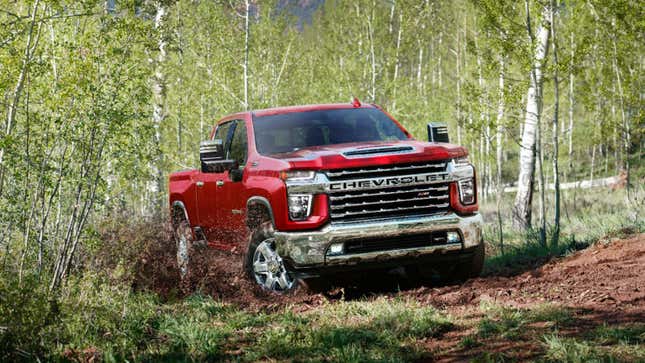 A photo of a red Chevrolet Silverado 2500HD pickup truck. 