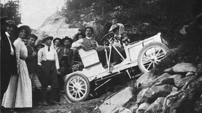 6th August 1909: A car lodged on the verge after a bad turn on the path up a mountain.