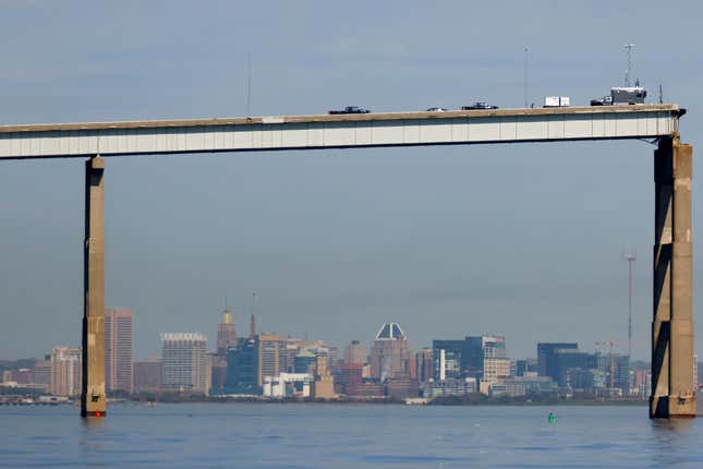 People work on a standing section of the collapsed Francis Scott Key Bridge, Monday, April 15, 2024, in Baltimore. The FBI confirmed that agents were aboard the Dali conducting court-authorized law enforcement activity. (AP Photo/Julia Nikhinson)