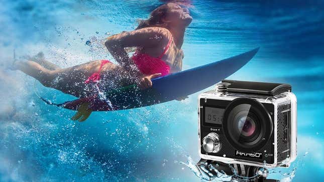 A woman diving through water on a surfboard with an Akaso Brave 4 camera in the foreground. 