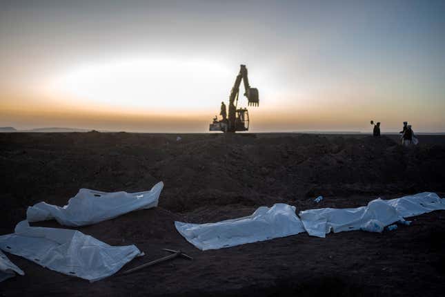 Afghans bury hundreds of people killed in an earthquake to a burial site, outside a village in Zenda Jan district in Herat province, western of Afghanistan, Monday, Oct. 9, 2023. Saturday&#39;s deadly earthquake killed and injured thousands when it leveled an untold number of homes in Herat province. (AP Photo/Ebrahim Noroozi)