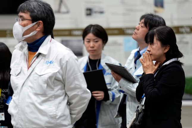 Staff of Japan Aerospace Exploration Agency (JAXA) watch a live streaming of the pinpoint moon landing operation by the Smart Lander for Investigating Moon (SLIM) spacecraft at JAXA&#39;s Sagamihara Campus Saturday, Jan. 20, 2024, in Sagamihara near Tokyo. (AP Photo/Eugene Hoshiko)