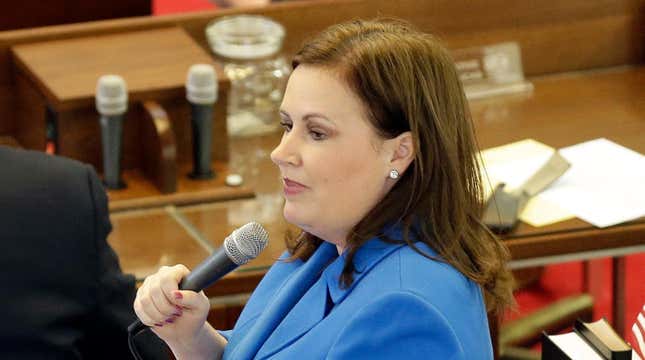 Rep. Tricia Ann Cotham, D-Mecklenburg, speaks on the House floor as North Carolina lawmakers gather for a special session Wednesday, March 23, 2016 in Raleigh, N.C. Lawmakers will consider stopping a new Charlotte ordinance set to take effect April 1 that gives protections to transgender people to use the restroom of their gender identity. (AP Photo/Gerry Broome)