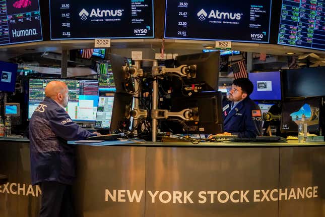 FILE -Traders work at their stations at the New York Stock Exchange, Friday, May 26, 2023, in New York. Corporate profits should have hit bottom already: After falling for much of the last year, S&amp;P 500 companies are expected to report 0.2% profit growth for the summer. While that sounds anemic, it would be the first quarter of growth in a year, according to FactSet. For three straight quarters, profits have fallen from year-ago levels due to pressure from higher costs and a fragile global economy. Hopes for a return to growth are crucial for the stock market to extend this year’s rally. (AP Photo/John Minchillo, File)