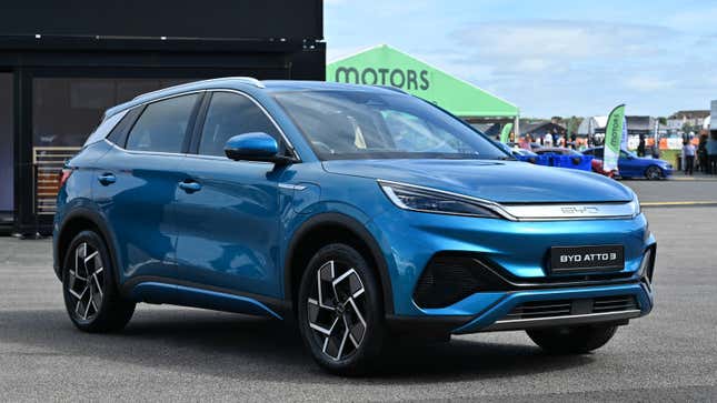 A photo of a blue BYD EV at a motor show. 