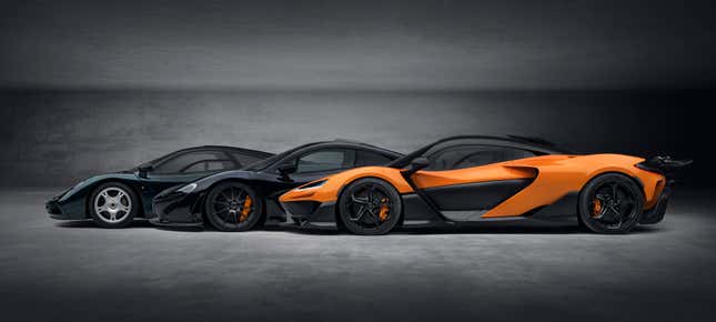 Side view of an orange McLaren W1 with a P1 and F1