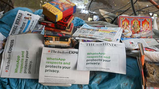 An advertisement from WhatsApp is seen in a newspaper at a stall in New Delhi on January 13, 2021