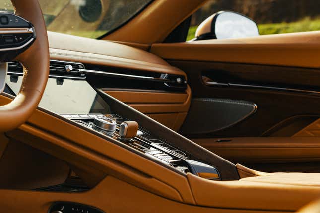 Center console of a brown Aston Martin DB12 Volante