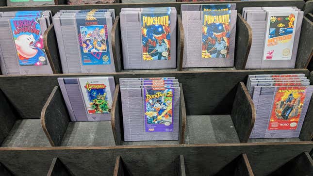 Coasters shaped like video game cartridges are on display at Comic Con.