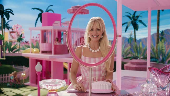 Barbie sits at her vanity inside her dreamhouse